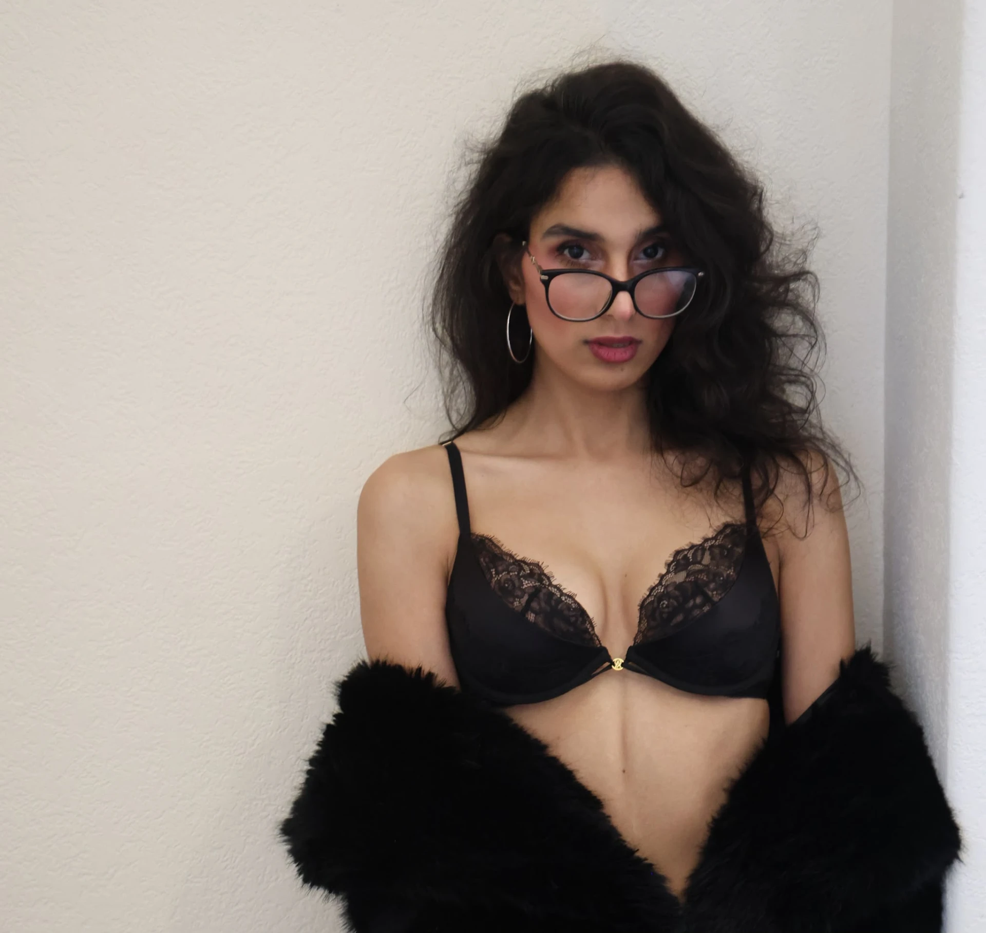 Irha in a black lace lingerie look with glasses